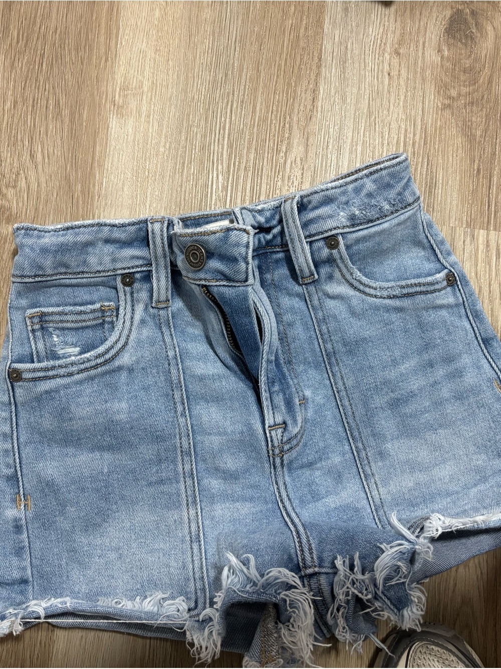 High-Rise Light Blue Distressed Denim Shorts